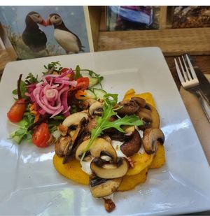 Chestnut mushrooms and garlic on polenta and garlic cream scheese . Homemade and gluten free . at Catchacarrot Vegan in Ardfern