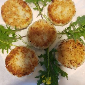 Homemade potato and dill cakes filled with walnuts and mushrooms . at Catchacarrot Vegan in Ardfern