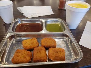 Paneer pakodas and mango lassi at Shiv Sagar in Houston