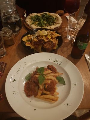 Jackfruit ragu, vegan nachos, and zucchini pizza at The Loft - Uluwatu in Pecatu