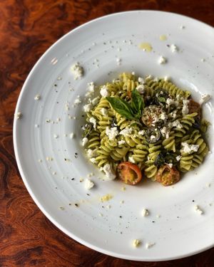 Vegetarian Basil Pesto Pasta w/ Tomatoes, Olives, Feta cheese & Hemp seeds. at The Castle in Kobe