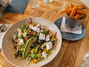 Salad with lots of veggies and vegan feta, sweet potato fries at LGW - Sonoma - NT  in Horley