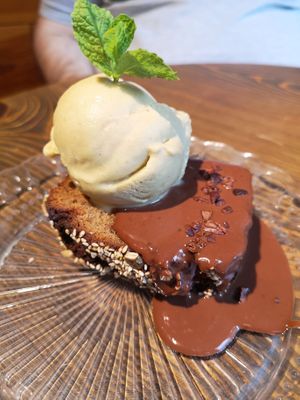 Banana bread with chocolate sauce and ice cream at Eqvilibrivm Cafe in Barcelona