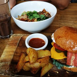 Cheese burger and poke bowl. Super good at Eqvilibrivm Cafe in Barcelona