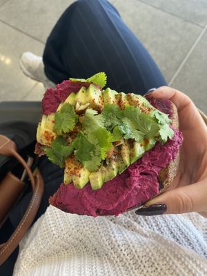 Avo toast with beetroot hummus  at Eqvilibrivm Cafe in Barcelona