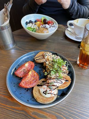 Savory pancakes and a chia/açaí bowl  at Eqvilibrivm Cafe in Barcelona