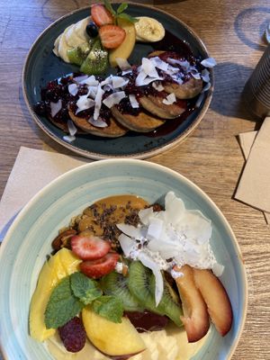 Super smoothie bowl and berry compote pancakes  at Eqvilibrivm Cafe in Barcelona