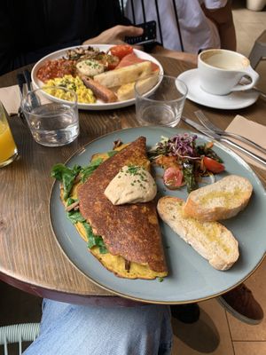 Delicious Vegan Tofu Omelet (in the front) and vegan Full English Breakfast (in the back)  at Eqvilibrivm Cafe in Barcelona