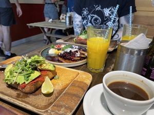 Avocado toast, coffee and freshly squeezed orange juice  at Eqvilibrivm Cafe in Barcelona