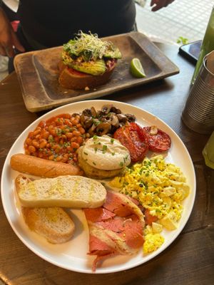 Vegan full English breakfast and avocado toast  at Eqvilibrivm Cafe in Barcelona