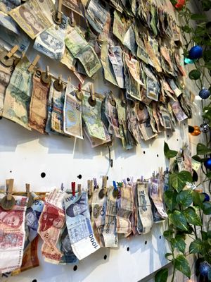 International notes from clients are pegged on the wall at Eqvilibrivm Cafe in Barcelona