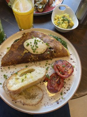 Omelette with side of tofu scrabble   at Eqvilibrivm Cafe in Barcelona