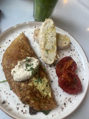 Scrambled tofu and green juice   at Eqvilibrivm Cafe in Barcelona