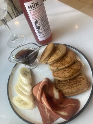 Maple pancakes with additional ‘bacon’ and kombucha   at Eqvilibrivm Cafe in Barcelona