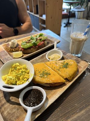 Melted cheese toast (asked for tofu scramble on the side) and the avocado toast (with hash brown on the side). SOOOOO GOOOD!!!  at Eqvilibrivm Cafe in Barcelona