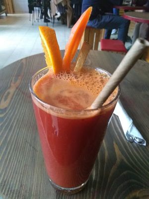 Fresh orange, ginger, carrot, and turmeric juice at Eqvilibrivm Cafe in Barcelona