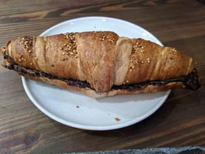 Croissant with dark chocolate filling at Eqvilibrivm Cafe in Barcelona