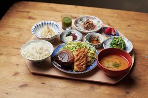 Set meal of tofu hamburger steak and cutlet with okara at Mumokuteki Vegan Cafe in Kyoto