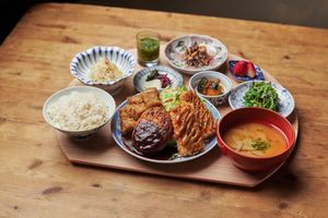 Set of tofu hamburger steak, cutlet with okara and fried tofu at Mumokuteki Vegan Cafe in Kyoto
