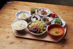Tofu, okara konnyaku, soybean meat, and several vegetables are used to create a satisfying hamburger with a variety of textures.  at Mumokuteki Vegan Cafe in Kyoto