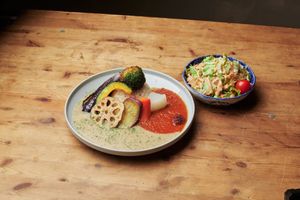 Two kinds of grated curry and cooked Kyoto vegetables at Mumokuteki Vegan Cafe in Kyoto