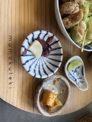 Pickle/ spiced pumpkin and a sliced grape!!  at Mumokuteki Vegan Cafe in Kyoto