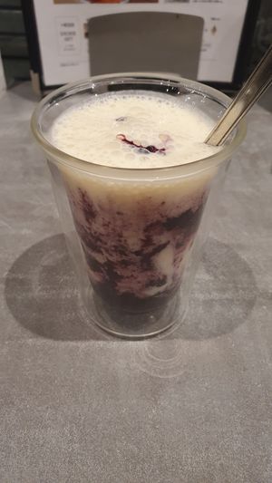 Soy yogurt drink with blueberries. So yummy. at Mumokuteki Vegan Cafe in Kyoto