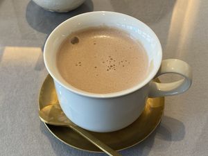 Hot chocolate (vegan). Not very sweet, but you can add sugar at Mumokuteki Vegan Cafe in Kyoto