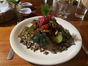 Steamed pumpkin filled with veggies atop rice and a sope at IX CAT IK in Valladolid