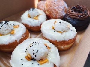 mango sticky rice, cocoa rogue, and cherry jam donuts. at Lovebirds Donuts in Kittery