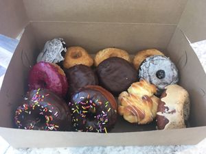 All so good! Glazed choc, old fashioned, blueberry, Boston creme, choc ganache, monkey muffin, dirty chai. Had to go back for glazed brioche and they had the blueberry fritter!!  at Lovebirds Donuts in Kittery
