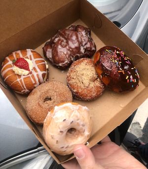Strawberry shortcake, apple fritter, chocolate ganache, apple cider, lemon lavender, and apple pie donuts! at Lovebirds Donuts in Kittery