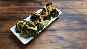 Roasted broccoli with turmeric tahini sauce & almond dukkah at Saluté Tapas Restaurant and Bar in Greytown