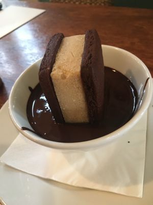 Almond milk ice cream cookie sandwich in chocolate sauce  at Saluté Tapas Restaurant and Bar in Greytown