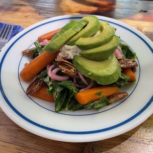 “Winter salad” with kale, pickled onions, carrots, cashew cheese, and candied pecans. And I added on avocado  at Planted in Brooklyn