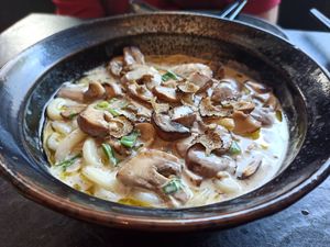 Udon noodles with mushrooms and truffle at PLANTA Queen in Toronto