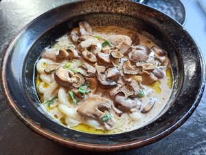Udon noodles with mushrooms and truffle at PLANTA Queen in Toronto