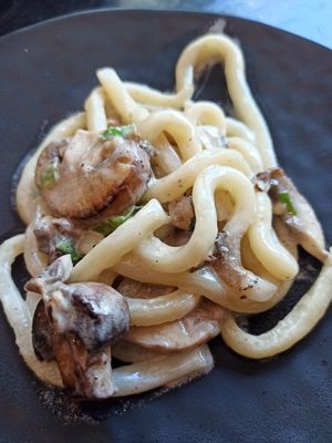 Udon noodles with mushrooms and truffle at PLANTA Queen in Toronto