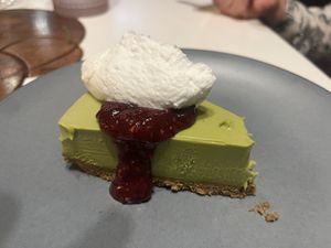 Matcha cheesecake with raspberry coulis and coconut cream  at PLANTA Queen in Toronto