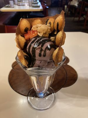 Bubble waffle, Taro ice cream rice crisps & black sessme caramel 😋  at PLANTA Queen in Toronto