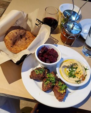 Plant-based lamb with hummus, beet salad, and pita at Oren's Hummus in San Francisco