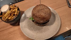 Lentil burger (vegan) and fries with vegan aioli at Stickerei in St Gallen