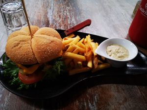 'House Burger' with Beyond Meat, vegan cheese, really good french fries and some garlic hummus. One of the very best burgers I've ever had, 10/10. (14,5 eur). at Classic & Vegan in Helsinki