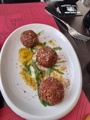 Aubergine walnut parmesan balls with pesto as a starter at B12 in Girona