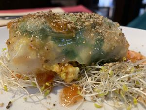 Scrambled tofu in a rice paper parcel with coriander and sweet chilli sauce   at B12 in Girona