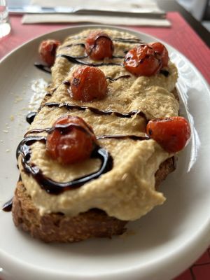 Hummus with roasted tomatoes and balsamic cream.  at B12 in Girona