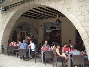 Terrace tables taken from the street at B12 in Girona