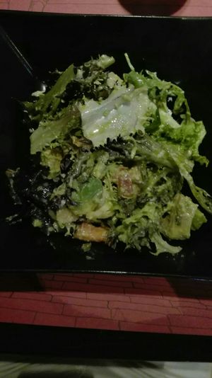 Salad of the day from menu: Caesar salad with vegan chicken, almond sauce, avocado, tomato and leafy greens at B12 in Girona