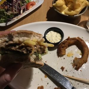 Vegan no meat burger made with meat substitute served with vegan cheese and onion rings and chunky chips with vegan mayo and salad 😋 at The Olive Tree in Castlebar
