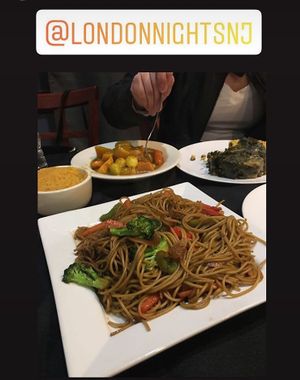 Veggie stir fry pasta, collards, side of rice and stewed veggie curry at London Nights in Belleville